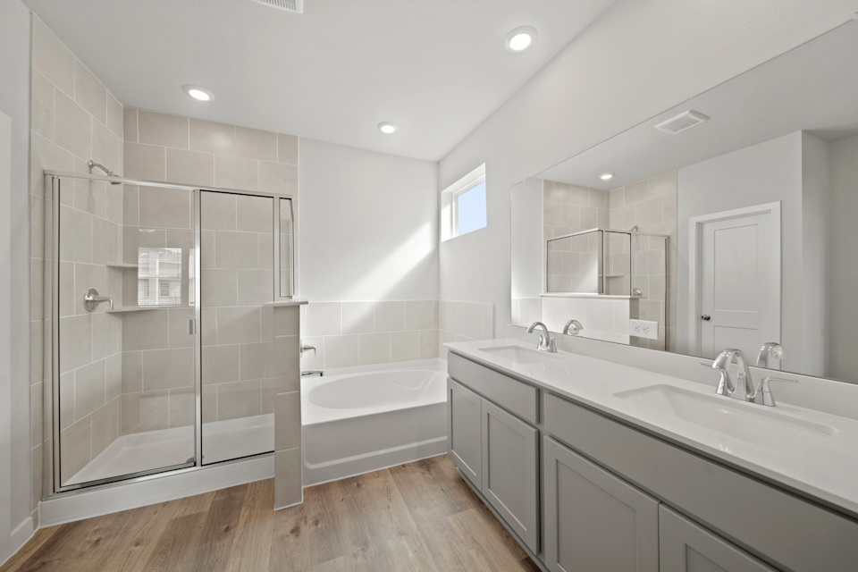 A bathroom with a glass shower.
