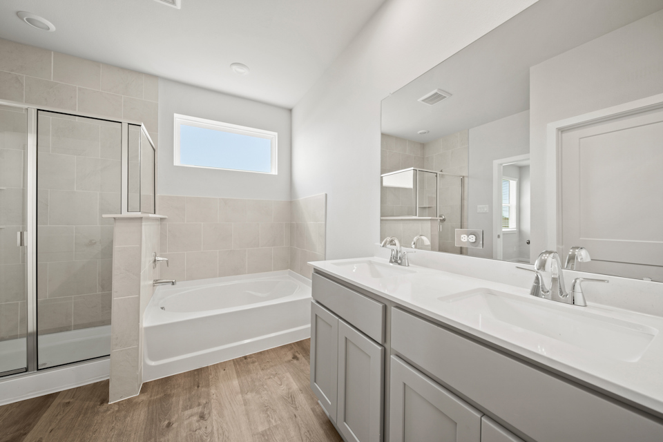 A bathroom with a tub and sink.