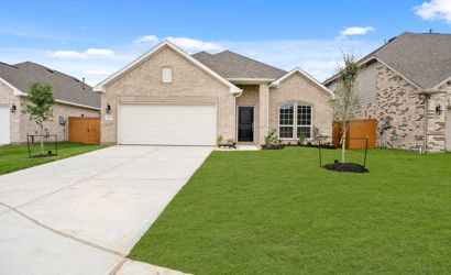 A house with a green lawn.