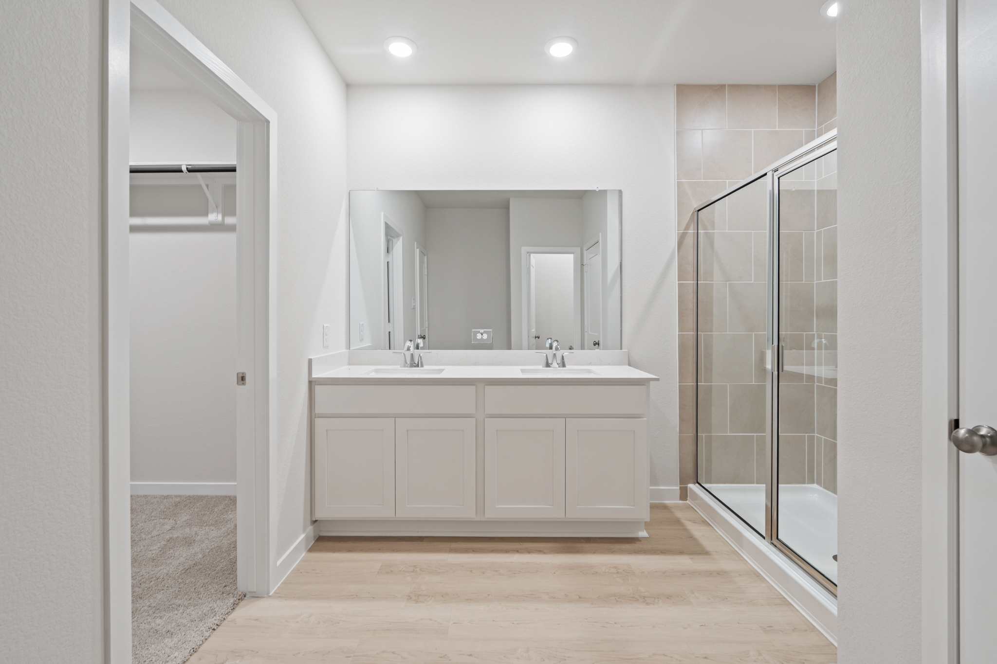 A bathroom with a glass shower.