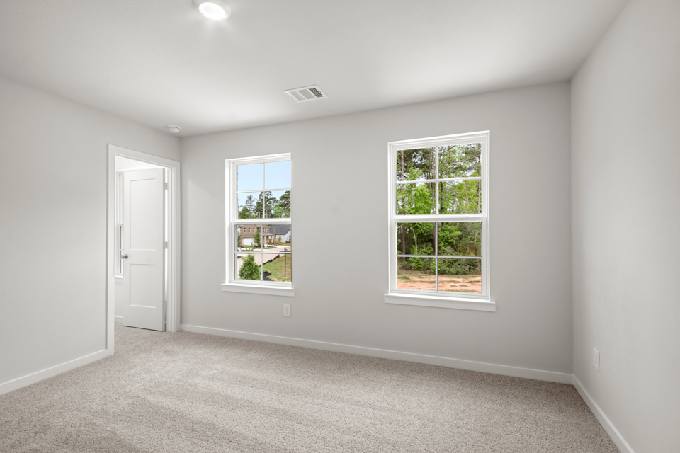 A room with windows and a door.