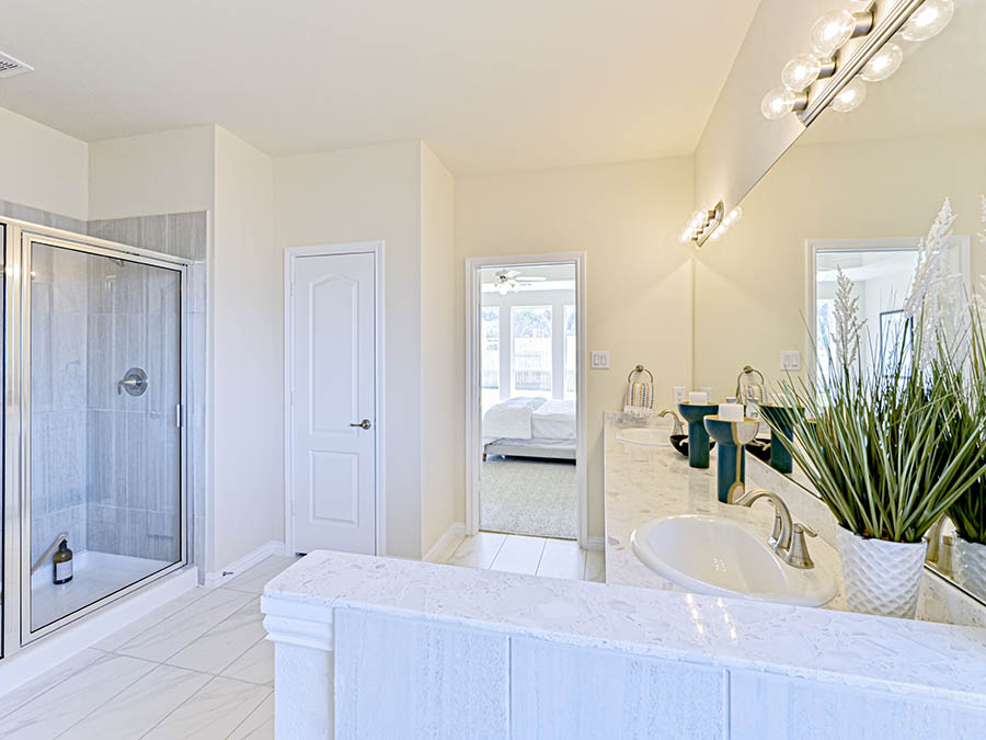 A bathroom with a tub sink and a toilet.
