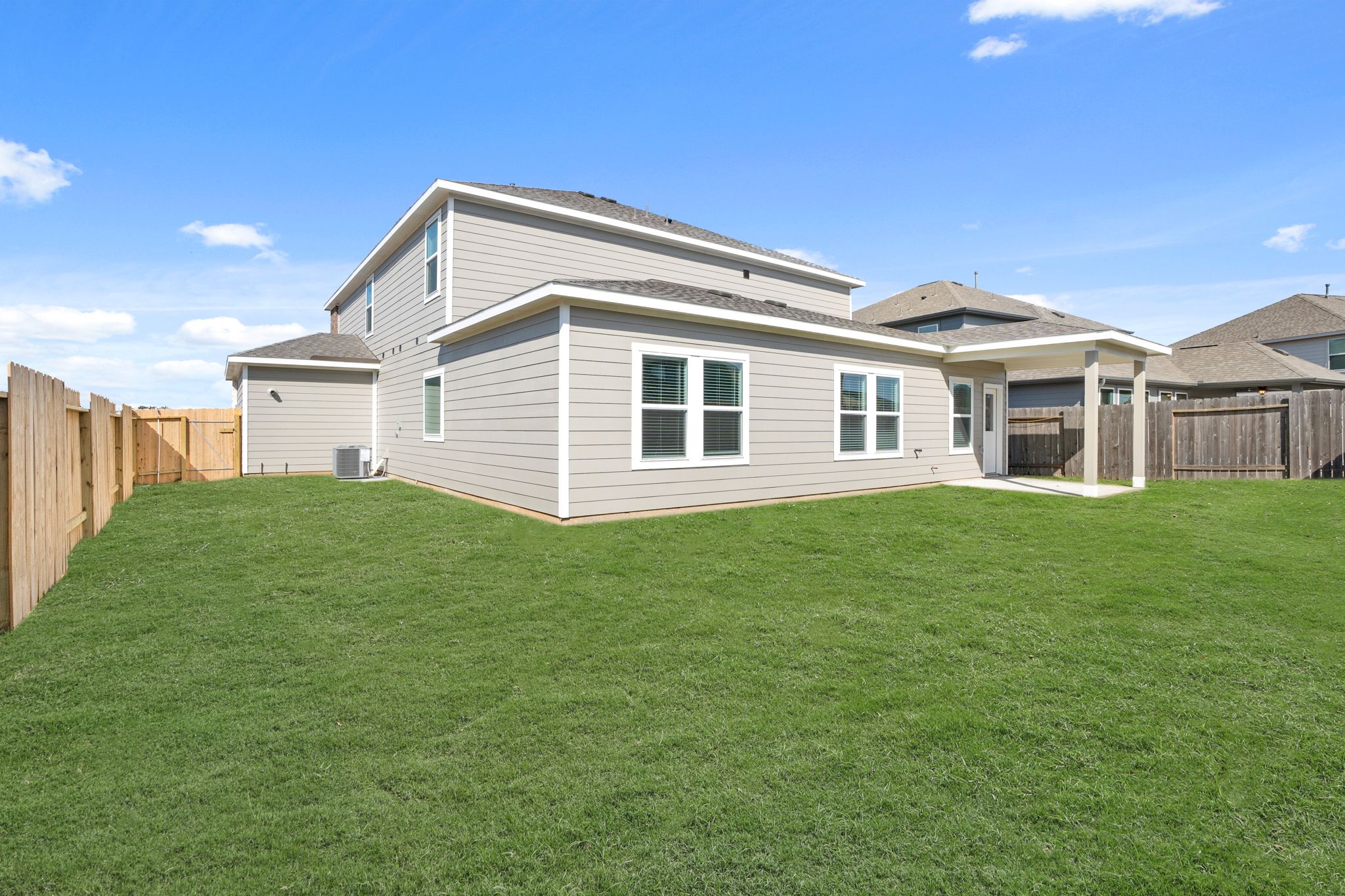 A house with a green lawn.