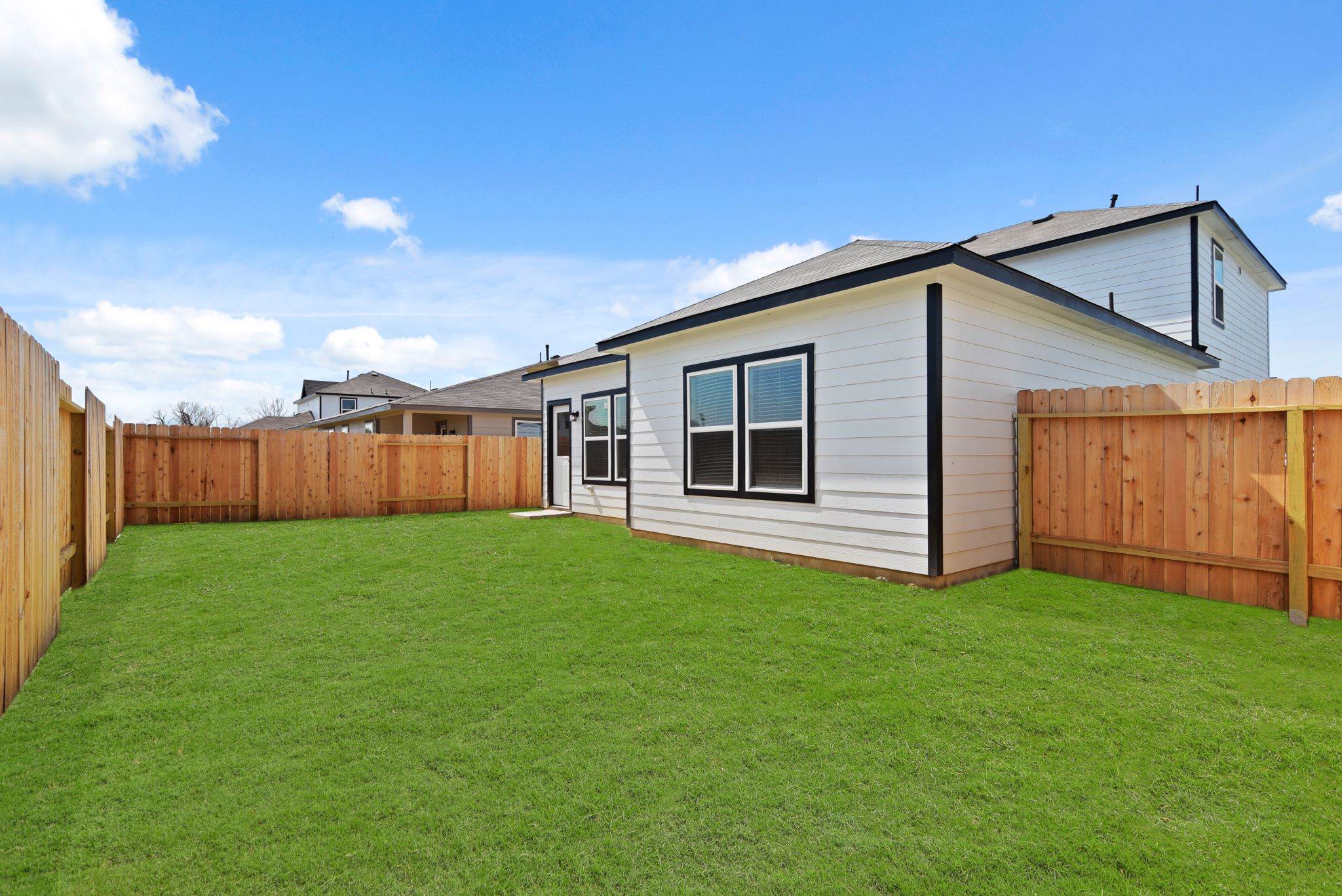 A house with a fence around it.