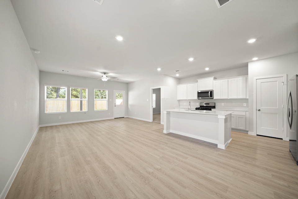 A large kitchen with white cabinets.