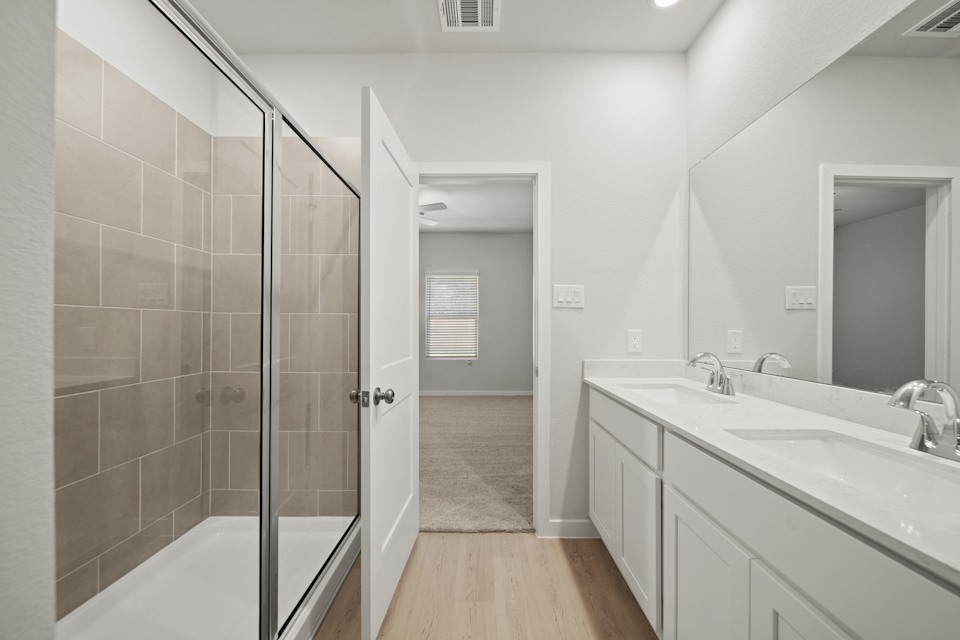A bathroom with a glass shower.