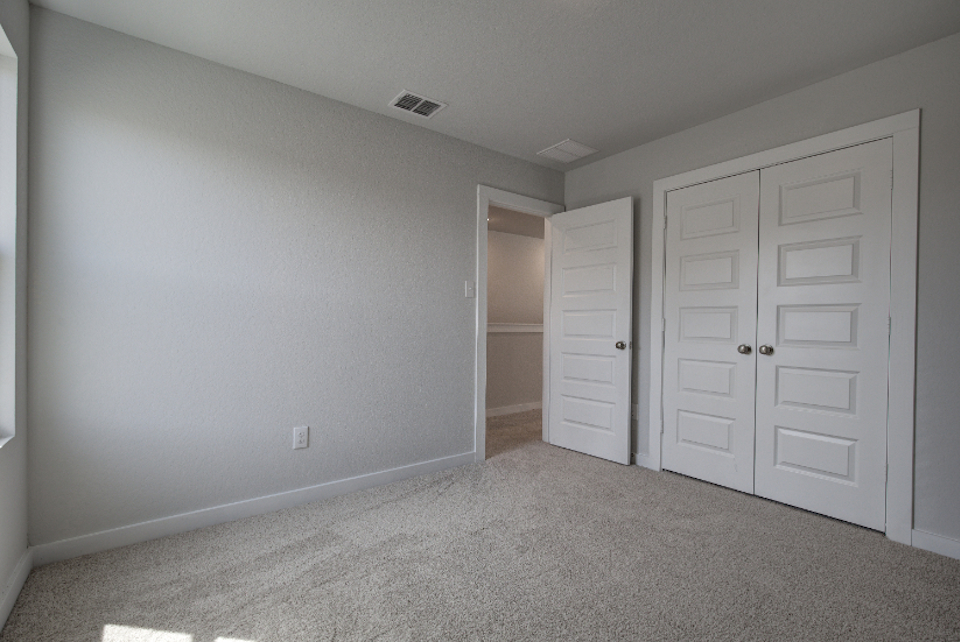 A room with white doors.