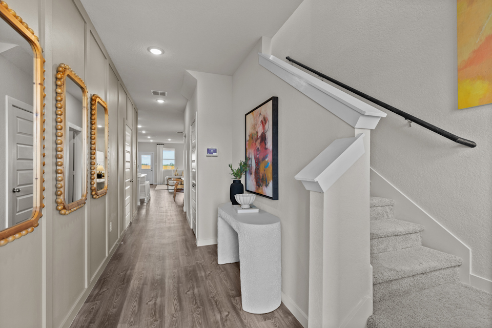 A hallway with white walls.
