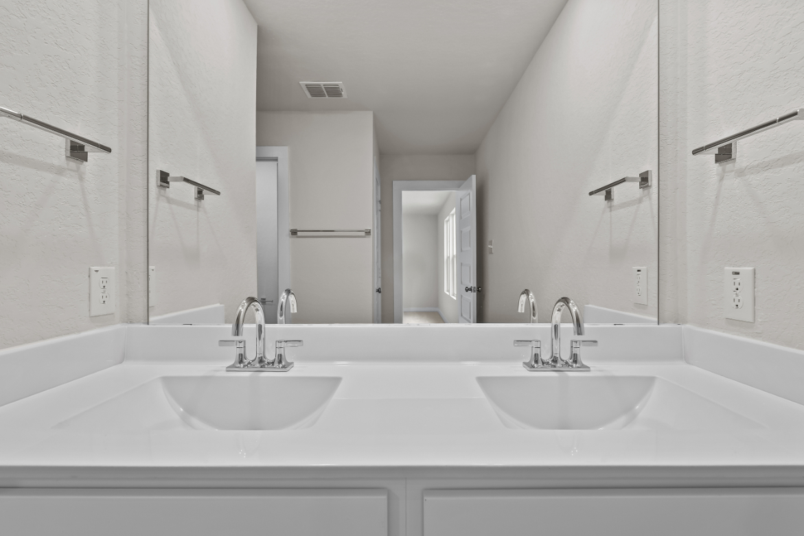 A bathroom with two sinks.