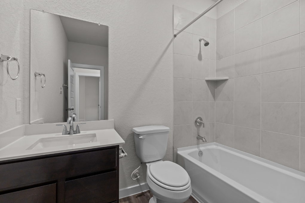 A bathroom with a toilet and sink.