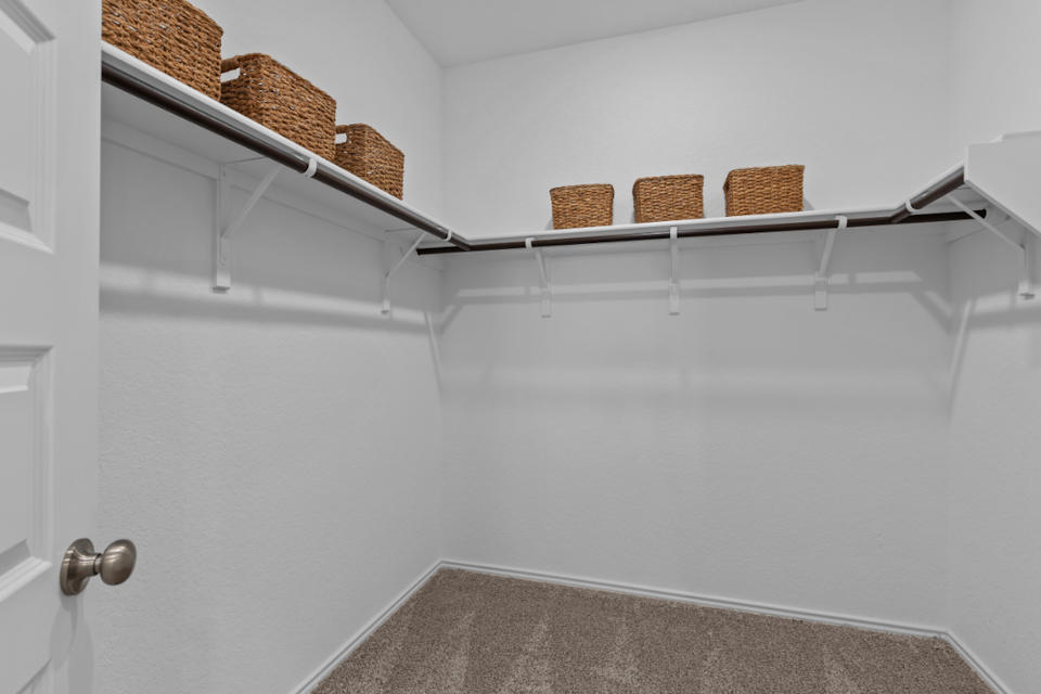 A shelf with baskets on it.