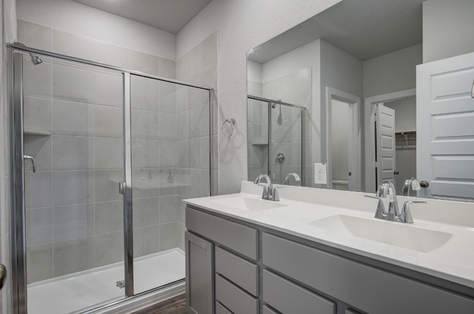 A bathroom with a glass shower.