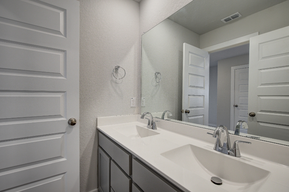 A bathroom with two sinks.