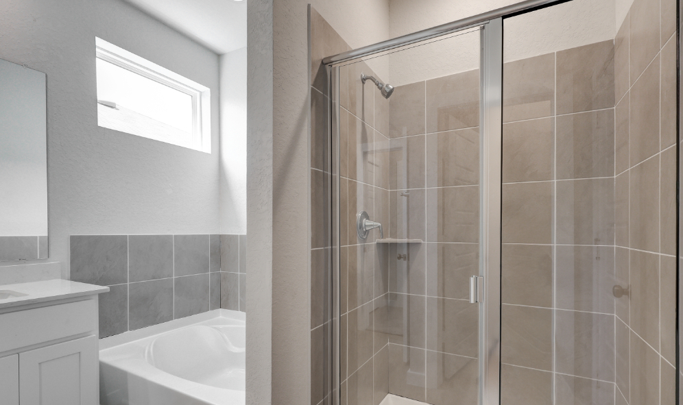 A bathroom with a glass shower.