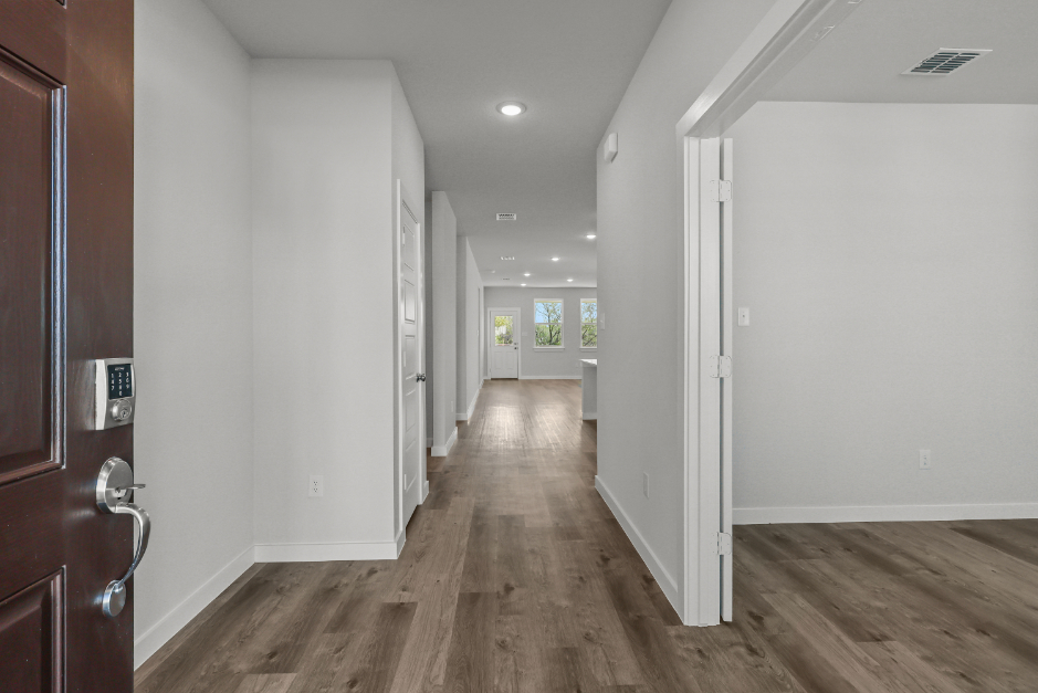 A hallway with white walls.