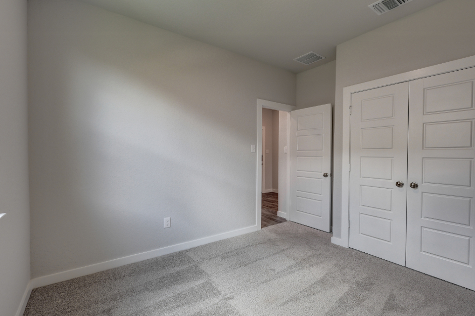 A room with white cabinets.