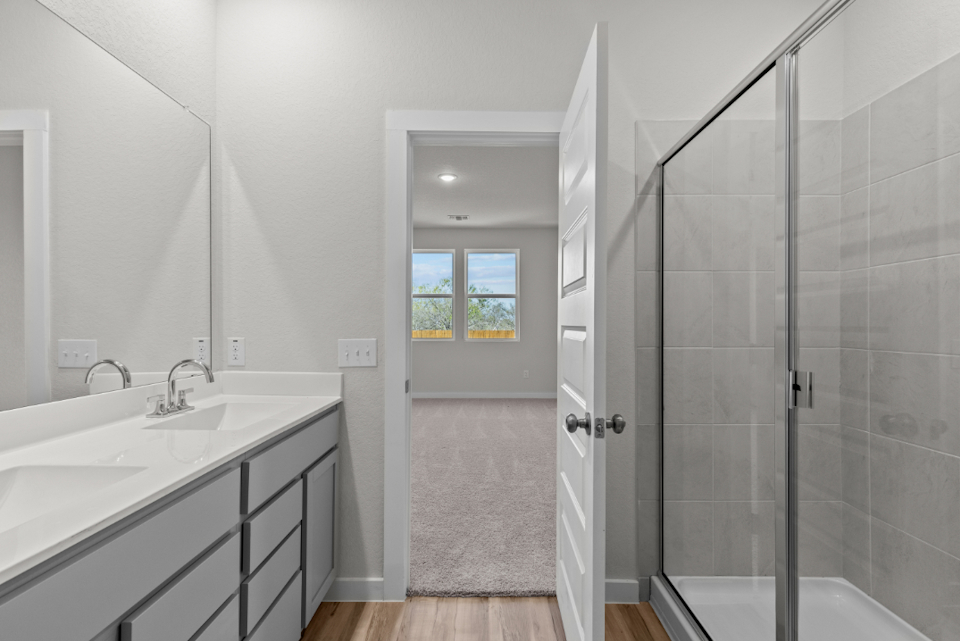 A bathroom with a glass shower.