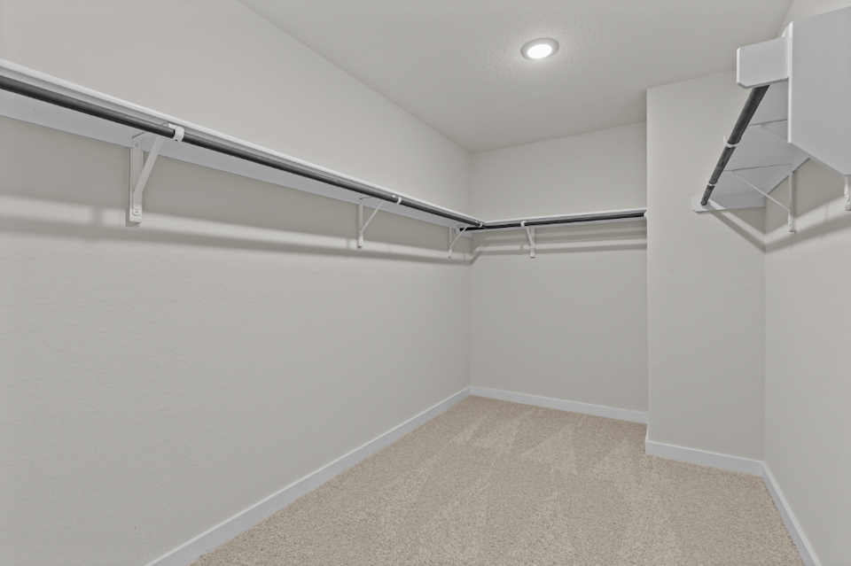A hallway with white walls.