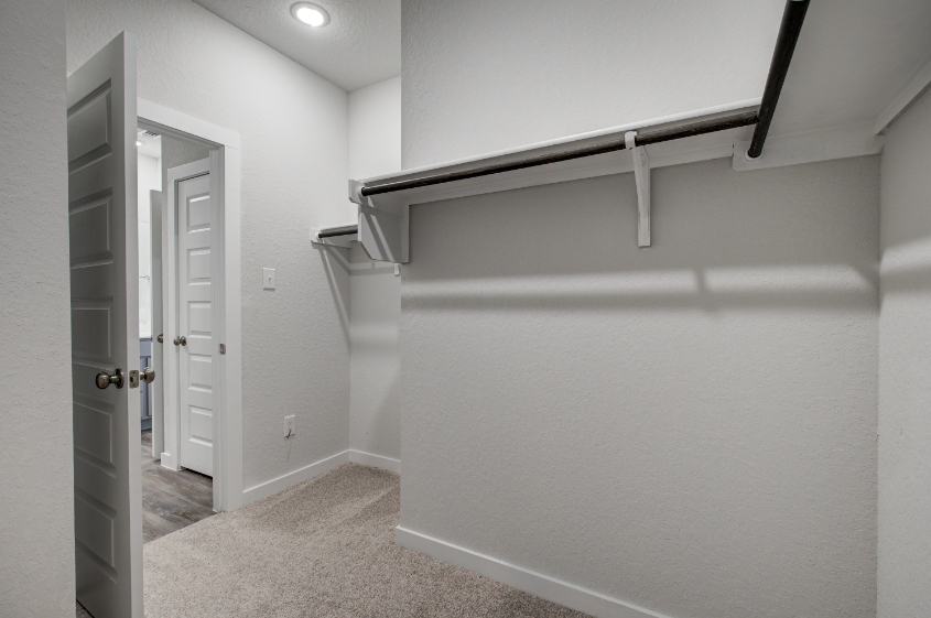 A hallway with white walls.