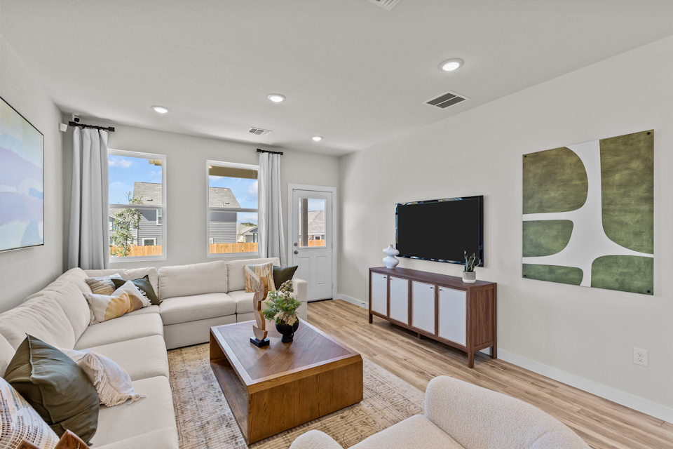 A living room with a tv and couches.