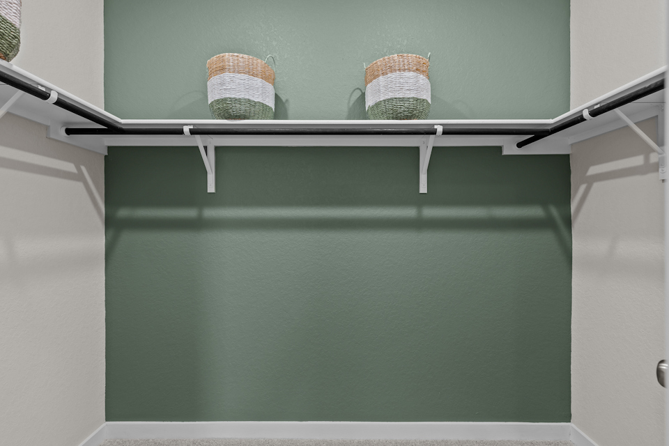 A couple of baskets on a shelf.