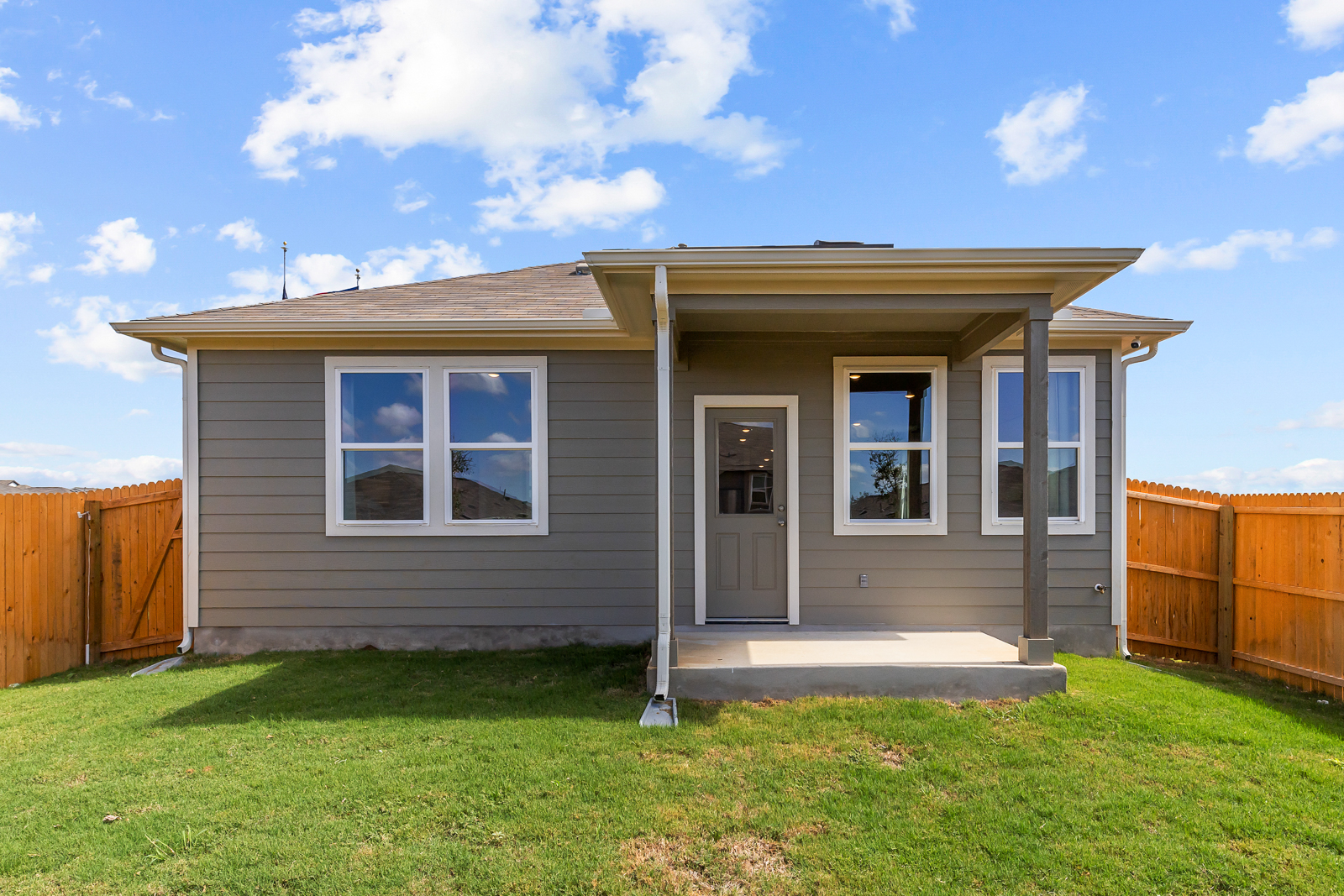 A small house with a fence.