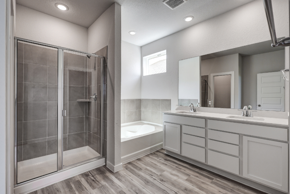 A bathroom with a glass shower.