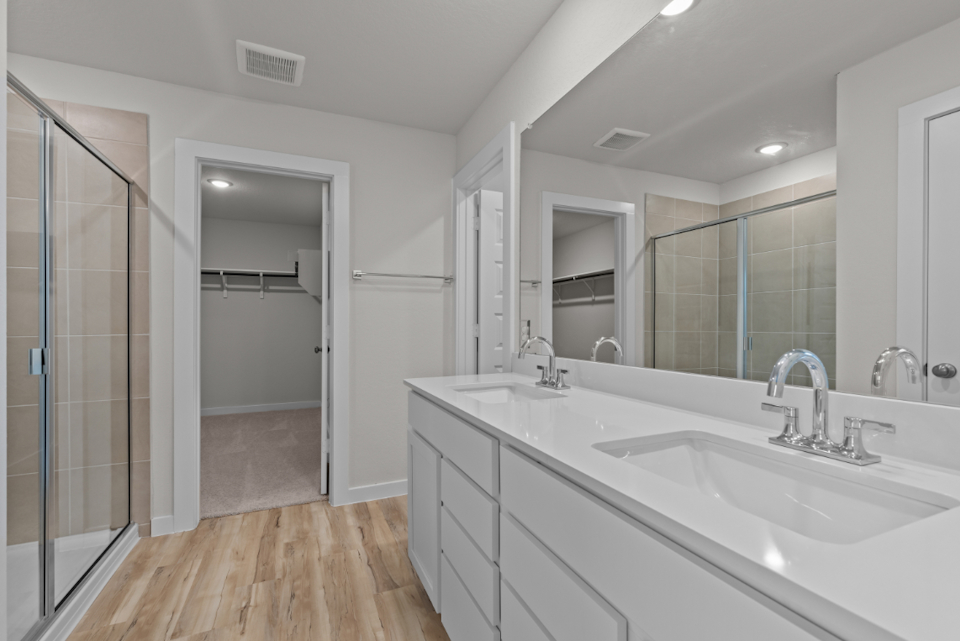 A bathroom with a glass shower.