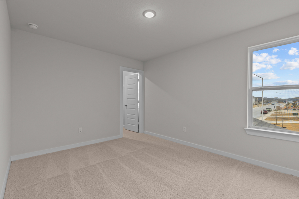 A room with a window and a door.