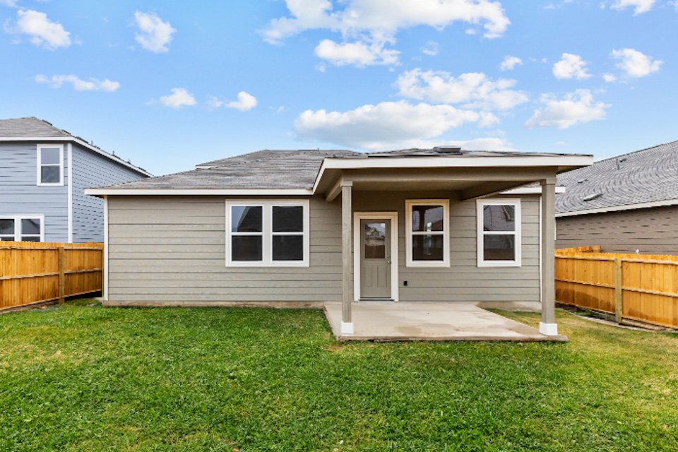 A small house with a fence.