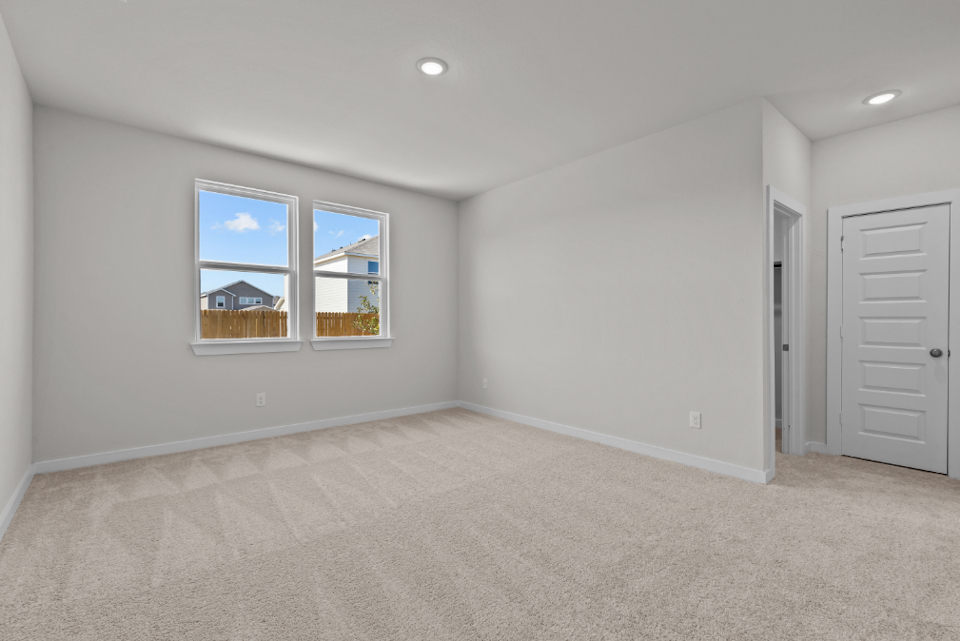 A room with a window and a door.