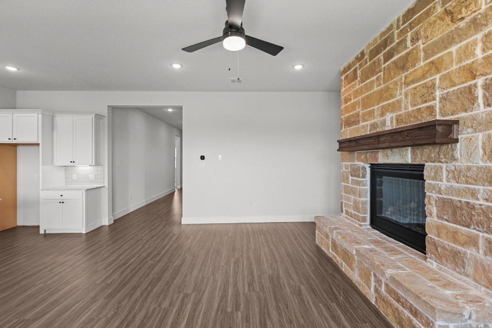A large kitchen with a fireplace.