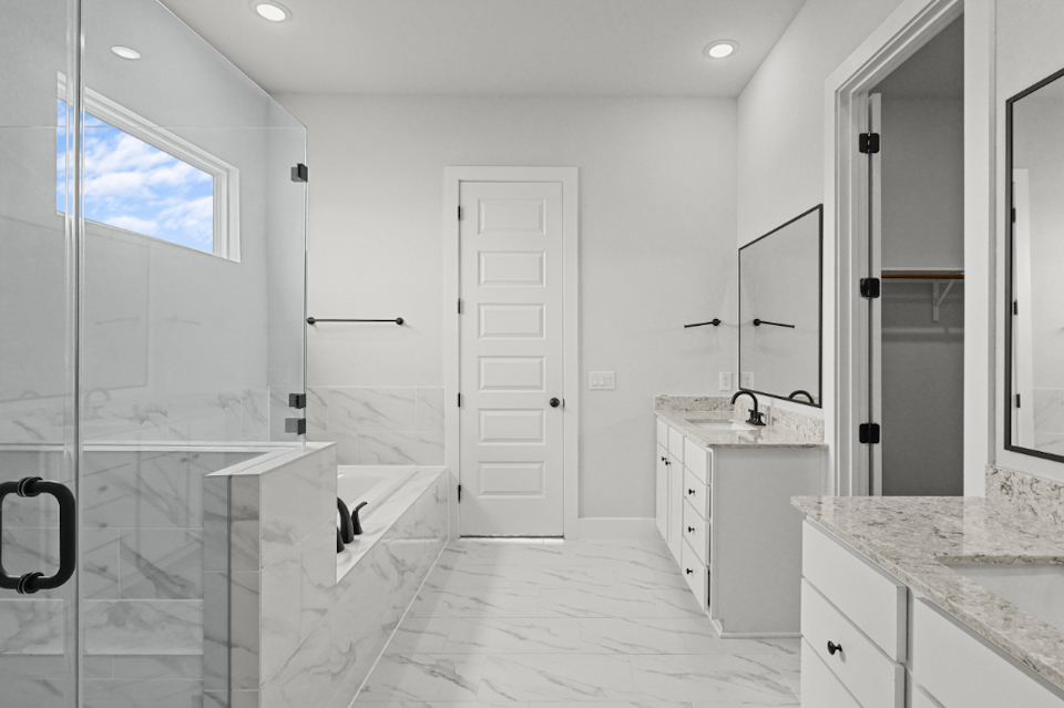 A bathroom with a glass shower.