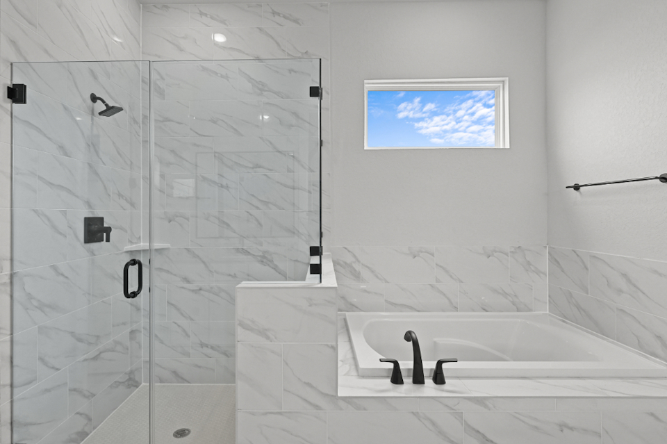 A bathroom with a glass shower.