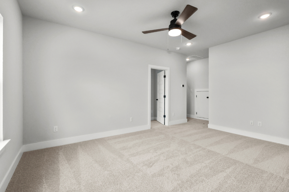 A room with a ceiling fan and a ceiling fan.