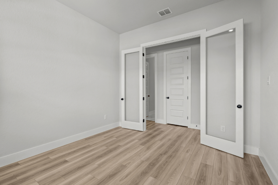 A room with white doors.