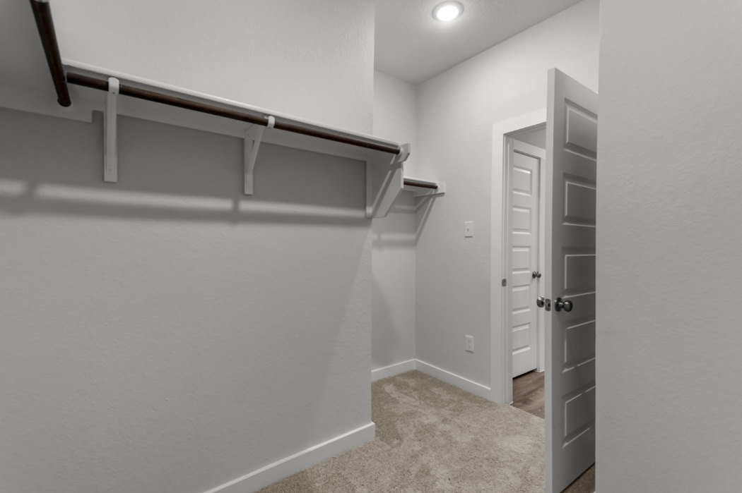 A hallway with white walls.