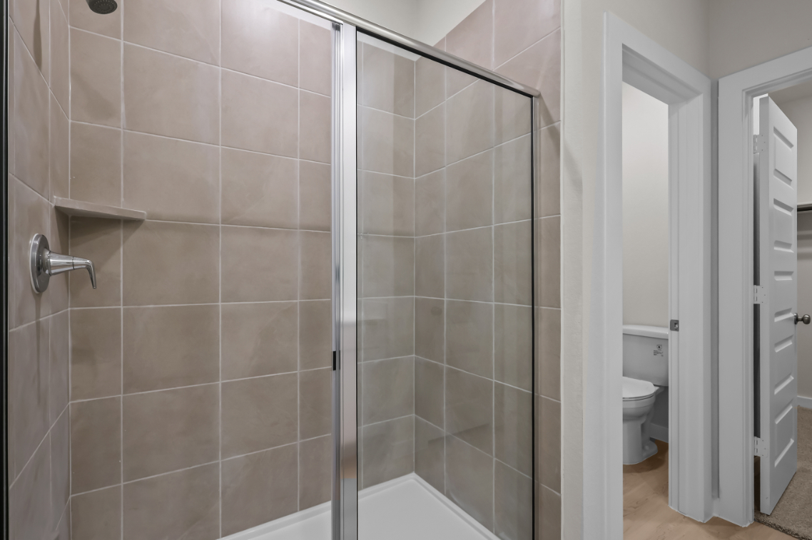 A bathroom with a glass shower.