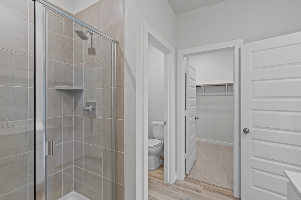 A bathroom with a glass shower.