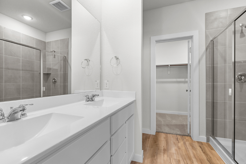 A bathroom with a glass shower.