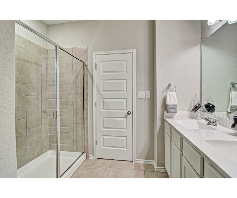A bathroom with a glass shower.