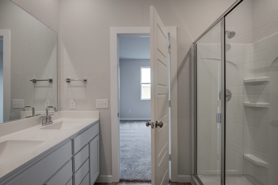A bathroom with a glass shower.
