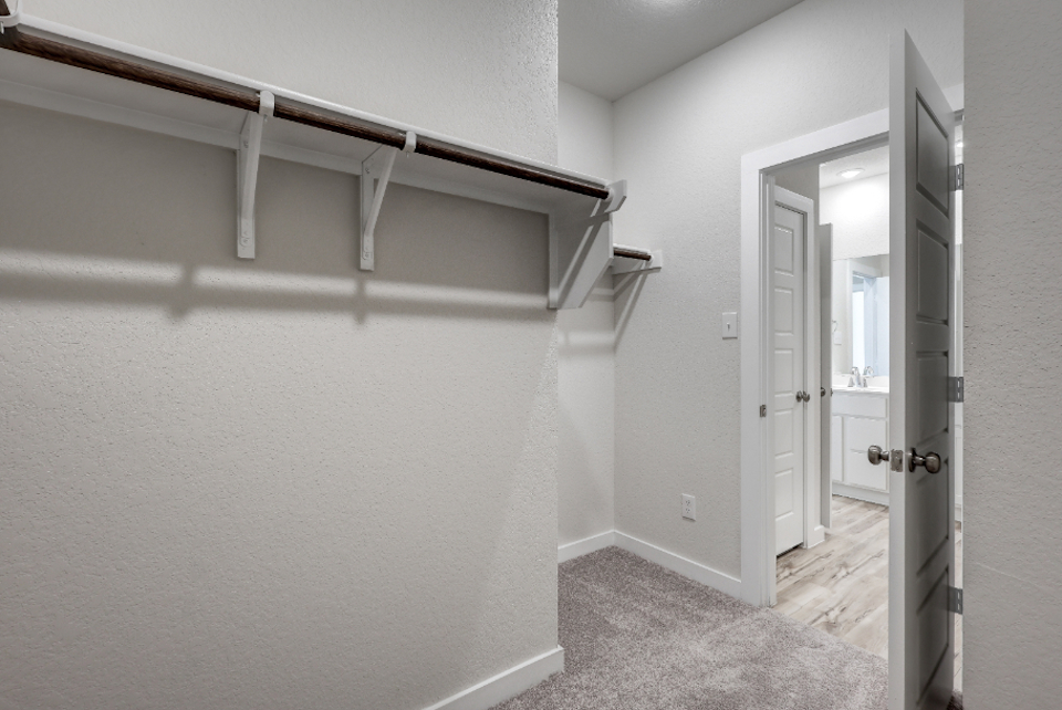 A hallway with white walls.