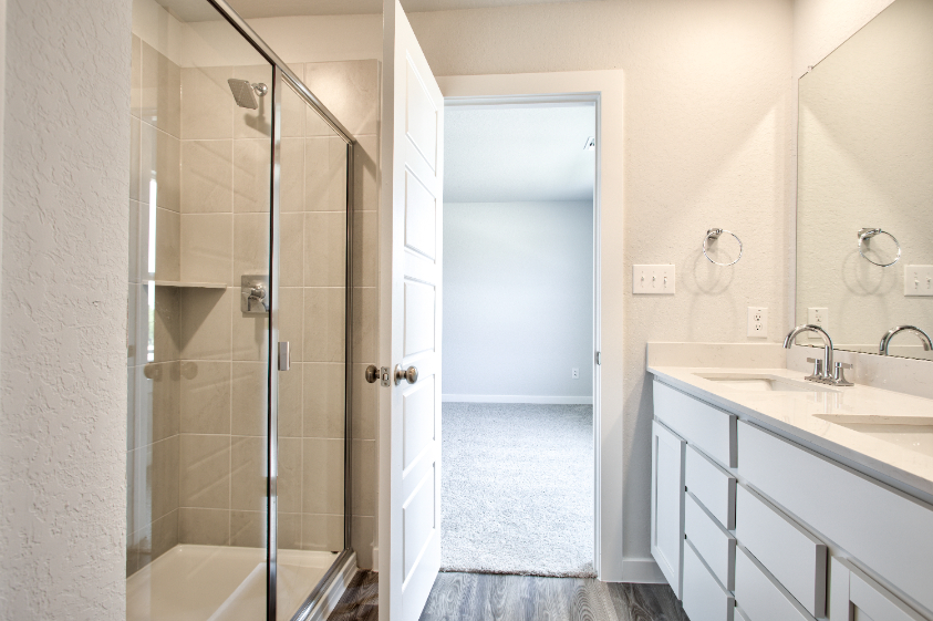 A bathroom with a glass shower.