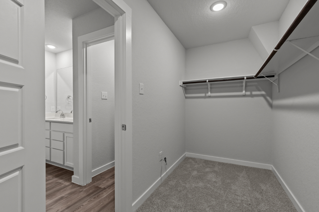 A bathroom with white walls.