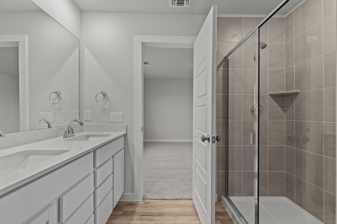 A bathroom with a glass shower.