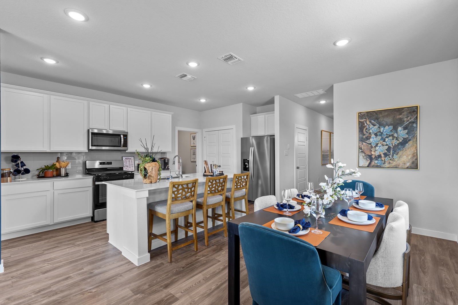 A kitchen with a dining table.