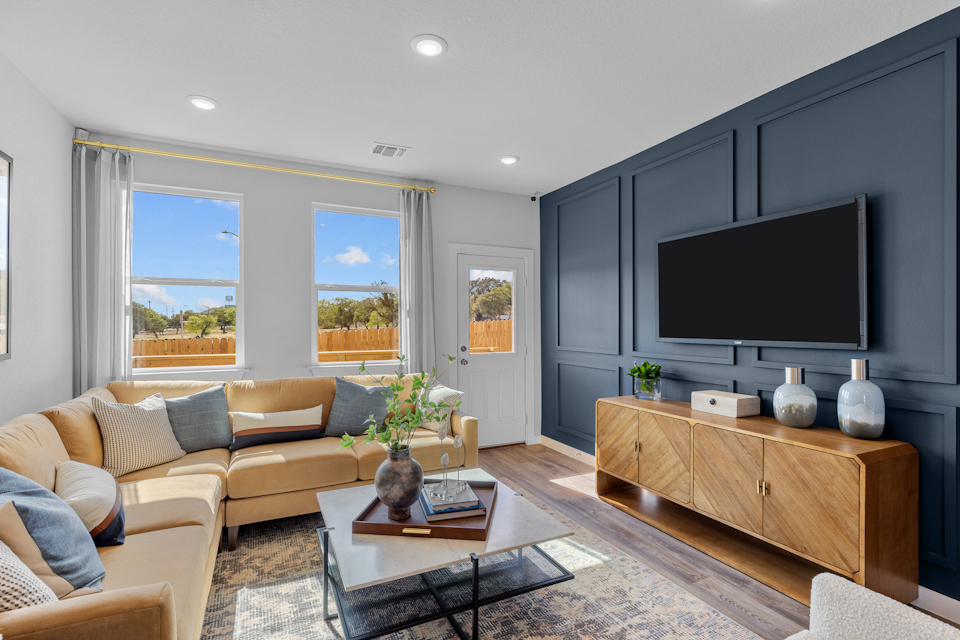 A living room with a tv and couches.