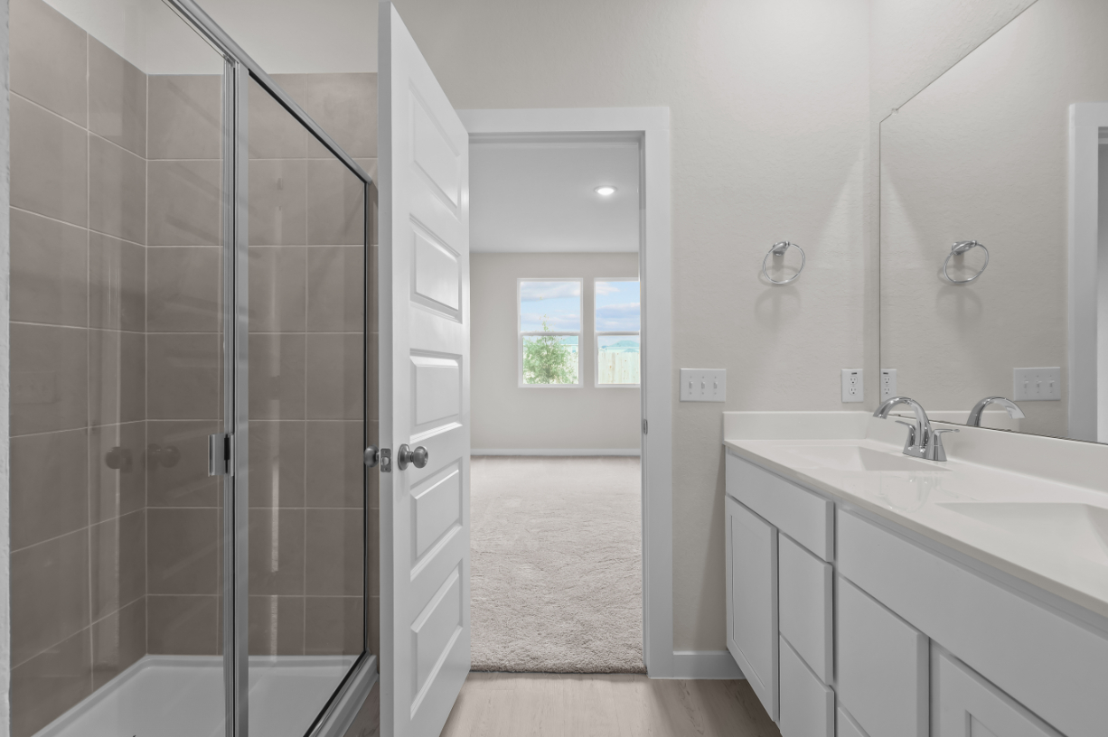 A bathroom with a glass shower.