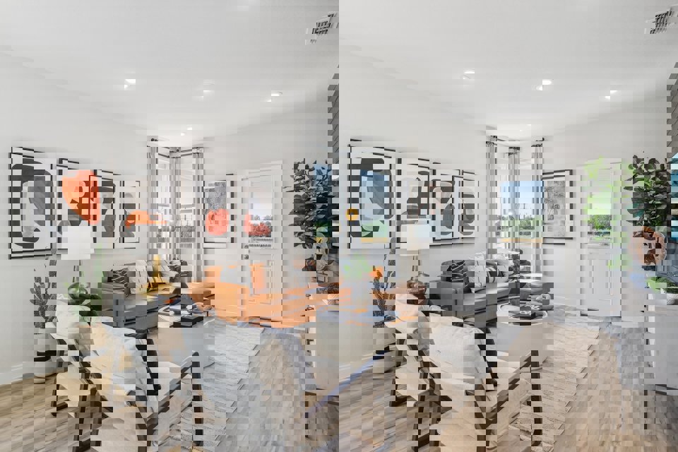 A living room with a couch and a table.